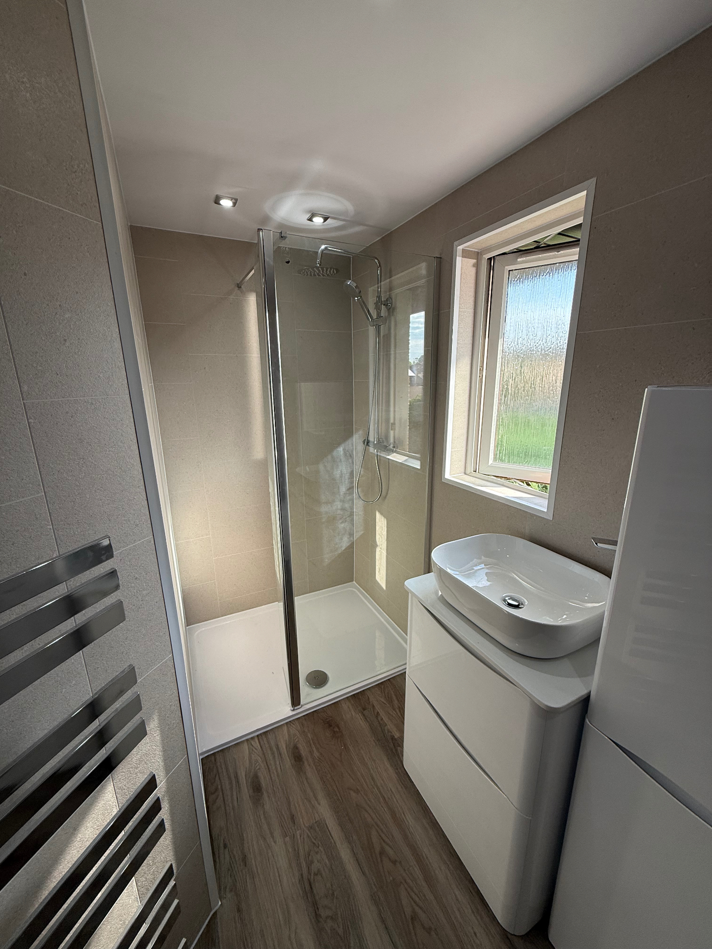Wet Wall Pros Premium bathroom package — luxury rainfall shower, chrome heated towel rail and UPVC wet wall paneling with designer fixtures