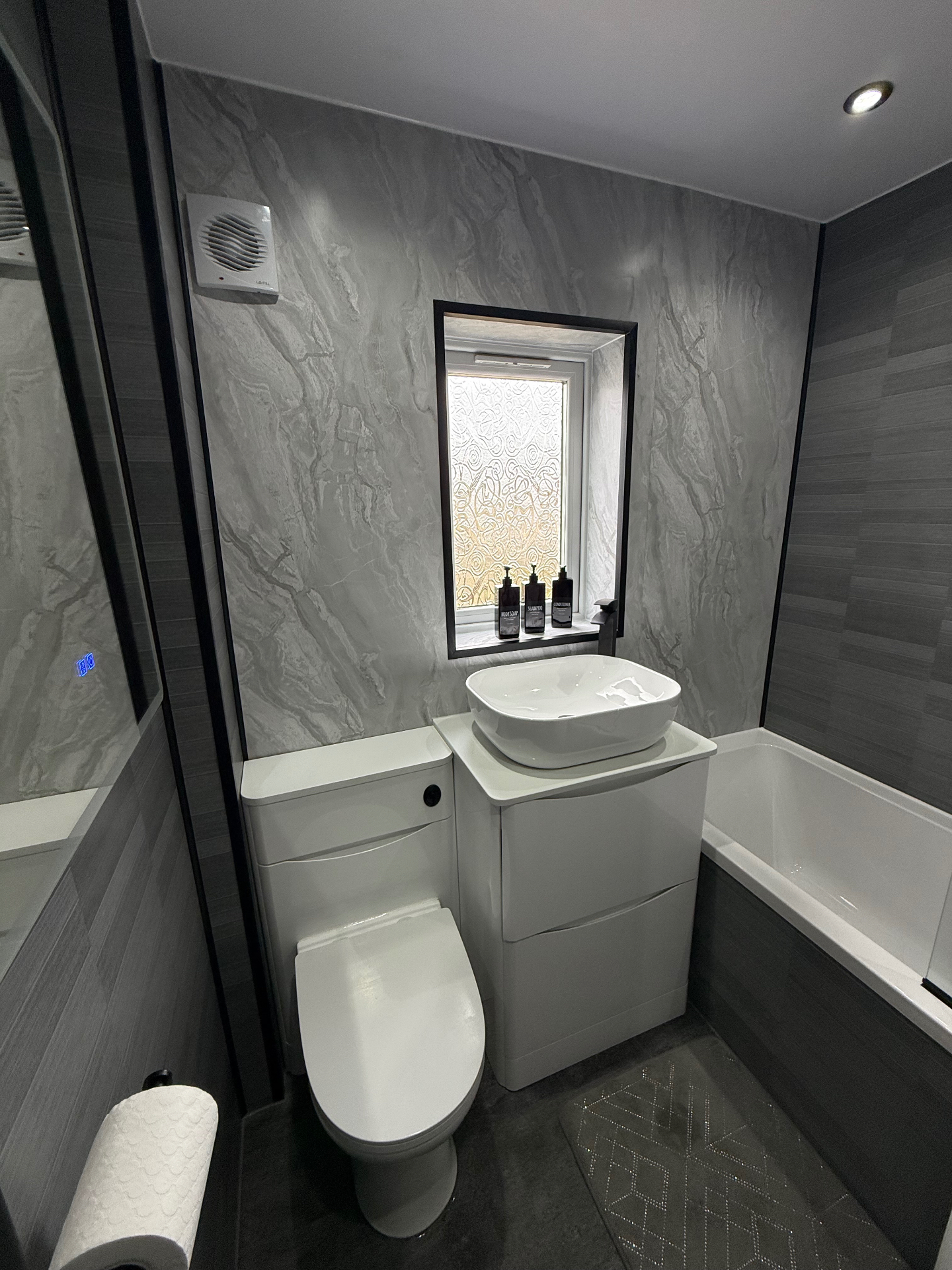 Bathroom facelift with white paneling